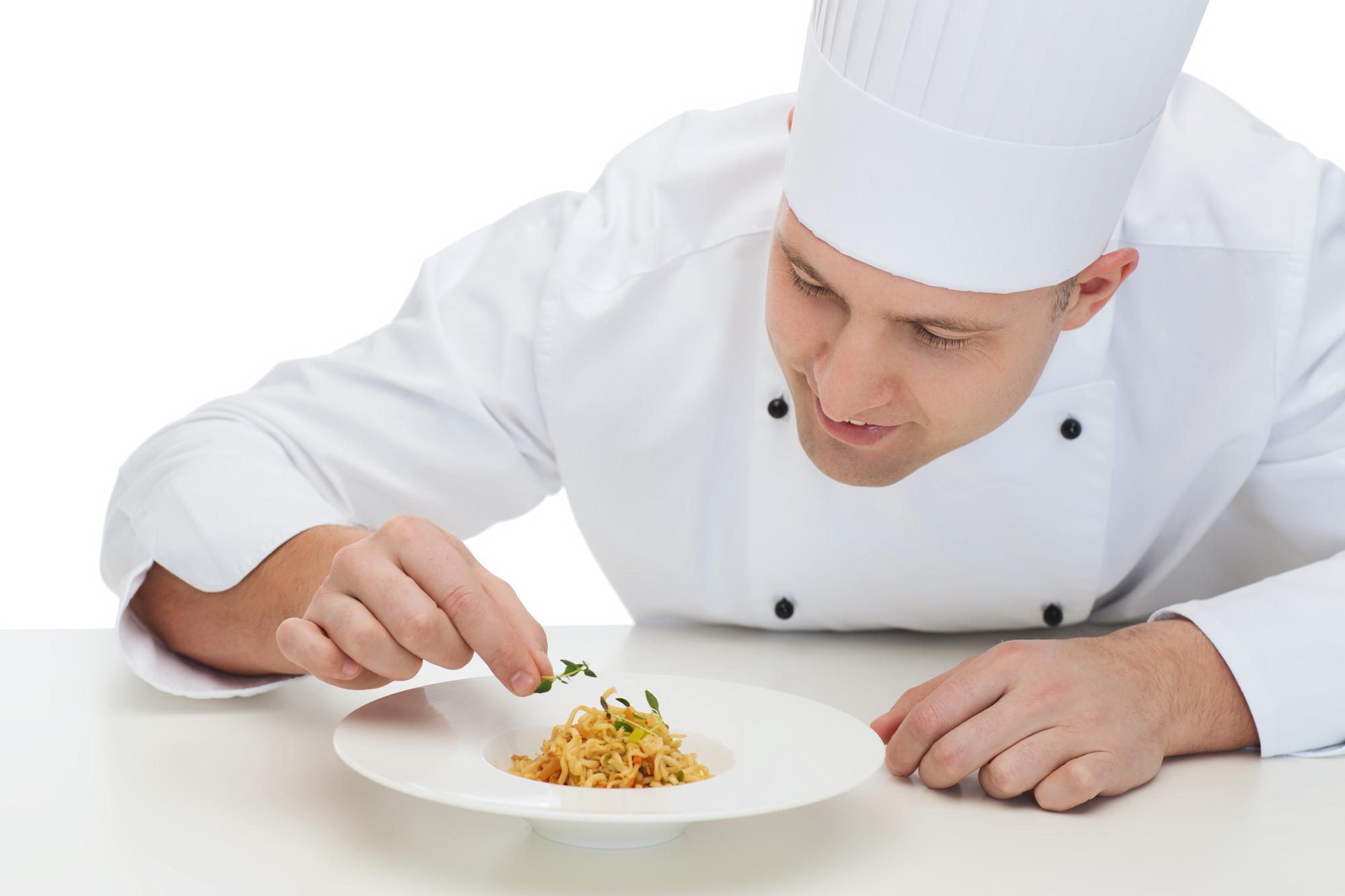 Student tasting a plated dish in workshop